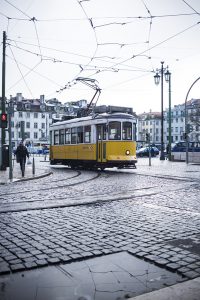 cloudy city trip, bright yellow tram in Lissabon