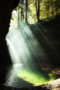 hidden waterfall in Tösstal, ice-cold and clear water, sunlight